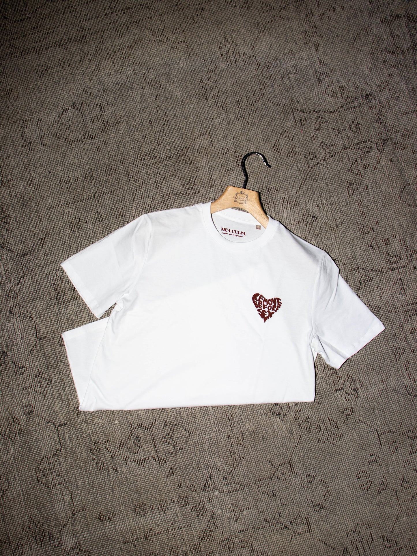 Alt Tag: White unisex T-shirt with heart logo, made in Italy, 100% cotton, part of Mea Culpa streetwear collection.