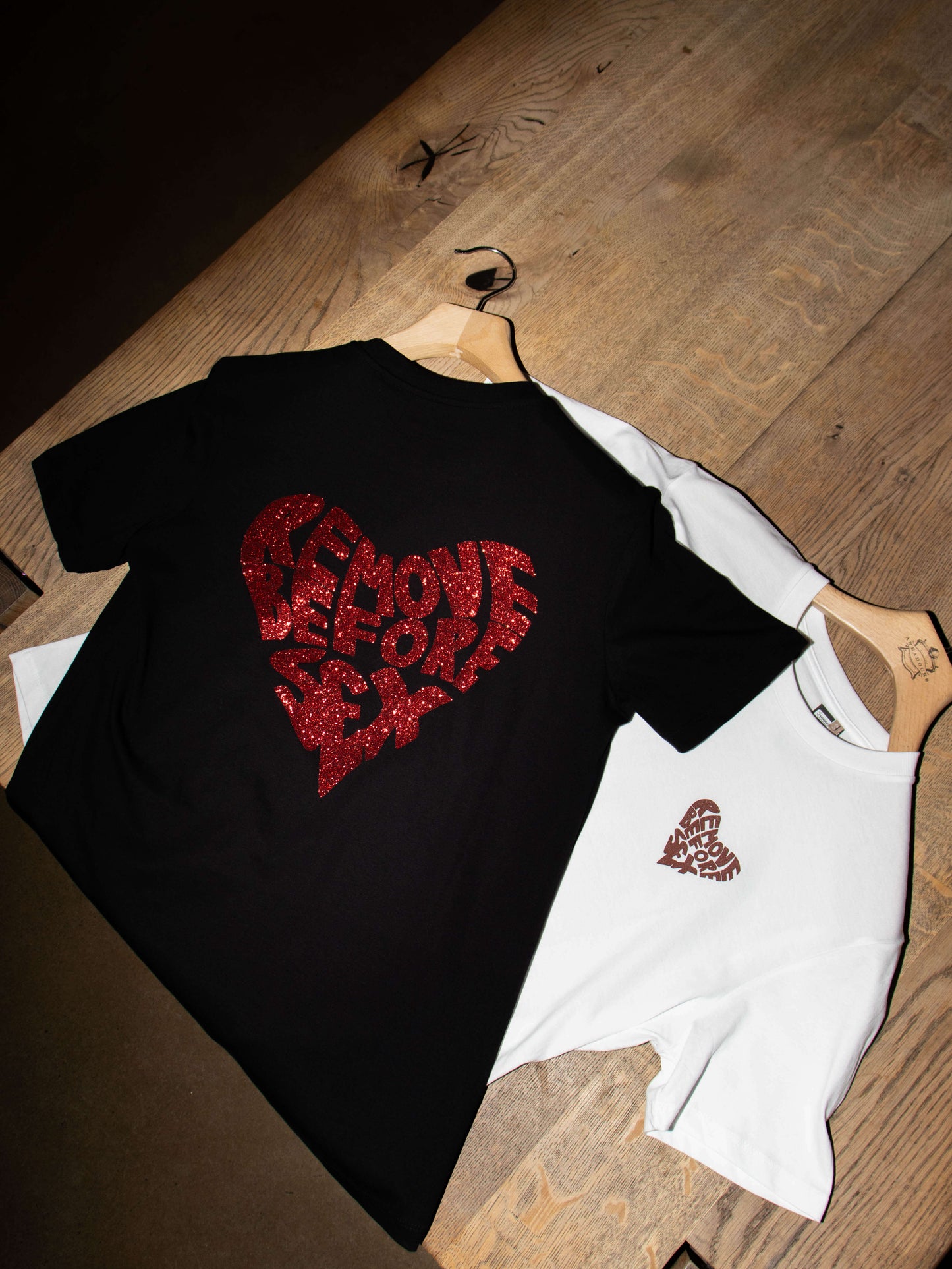 Black and white T-shirts featuring 'Remove Before Sex' logo, 100% cotton, unisex, made in Italy streetwear.