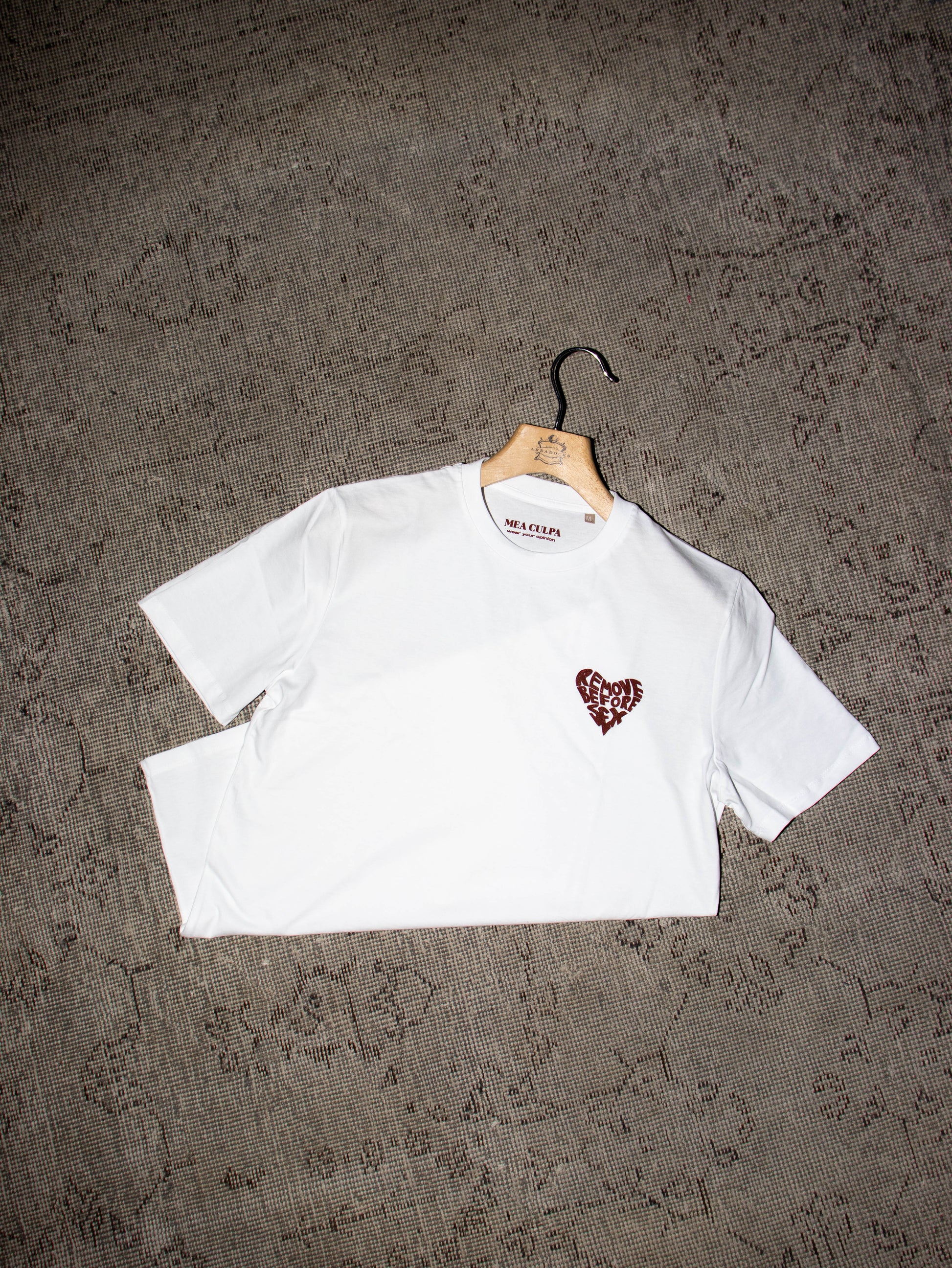 Alt Tag: White unisex T-shirt with heart logo, made in Italy, 100% cotton, part of Mea Culpa streetwear collection.